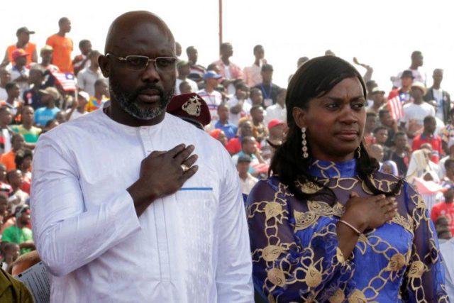 Liberia's new President George Weah stands with his wife Clar as they attend his swearing-in ceremony at the Samuel Kanyon Doe Sports Complex in Monrovia